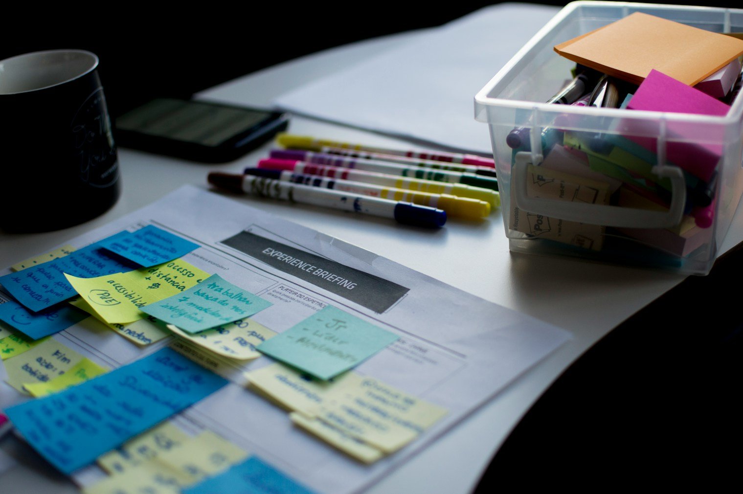 Experience briefing desk with markers and sticky notes